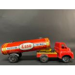 A tinplate and plastic model of an Esso petrol tanker.