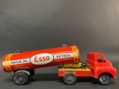 A tinplate and plastic model of an Esso petrol tanker.