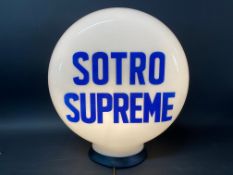 A Sotro Supreme glass petrol pump globe, large chunk missing from neck, otherwise good, dated