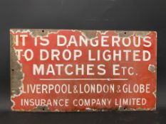 An enamel sign 'It is dangerous to drop lighted matches etc.' by the Liverpool & London & Globe