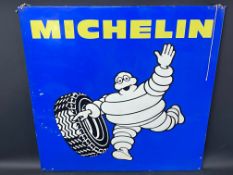 A Michelin aluminium advertising sign with an image of Mr Bibendum rolling a tyre, 29 1/2 x 29 1/