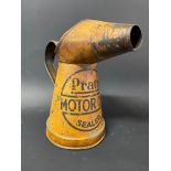 An early Pratts Motor Oil pint measure in original condition.