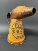 An early Pratts Motor Oil pint measure in original condition.