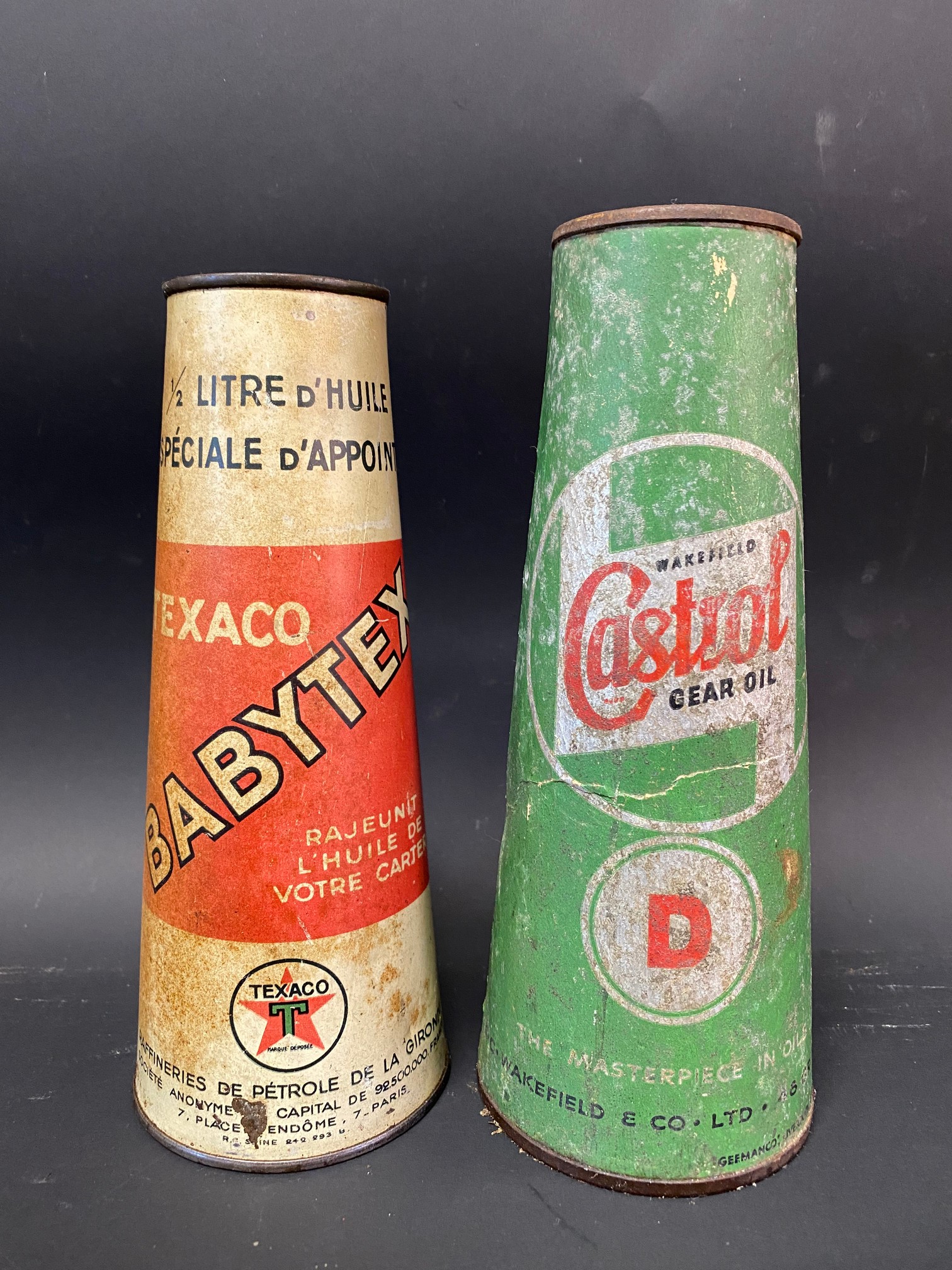 A Texaco Babytex conical cardboard can and a Wakefield Castrol Gear Oil conical cardboard can.