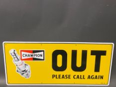 A new old stock Champion spark plug garage tin advertising sign 'Out', 23 x 10".