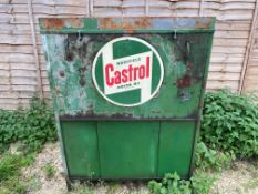 A Wakefield Castrol garage forecourt oil cabinet with a sign attached to the front.