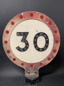 A small post mounted double sided 30 mph reminder sign, with glass reflective discs, 12 x 15".