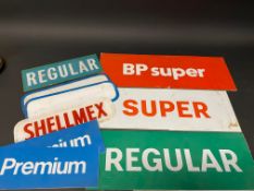 A selection of glass and plastic petrol pump brand inserts.