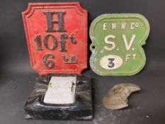 An early cast iron fire hydrant marker sign, an aluminium version by Needham, Stockport and two cats