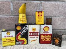 A selection of Shell oil cans including an X-100 Motor Oil, Tractor Universal measure etc.