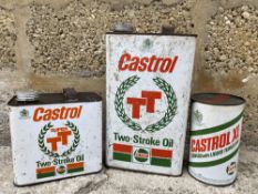 A Castrol TT Two Stroke Oil gallon can, a matching half gallon can plus a Castrol XL quart can,