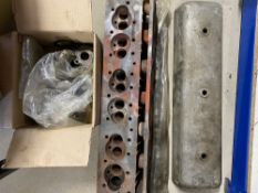 An Alvis 6-cylinder head, rocker cover, a camshaft and a box of 6-cylinder parts.