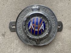 An RAC Associate car badge with Hong Kong enamel centre.