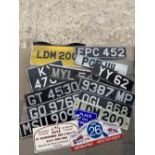 A quantity of old number plates, plus three rally plates.