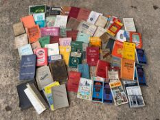 A quantity of handbooks, manuals, instruction books, maps including pre-war Austin, Bacon's maps