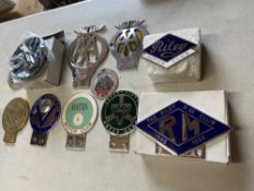 A group of car badges including the Riley Club, the Riley RM Club, VSCC, Smith's Motor Club, Seven