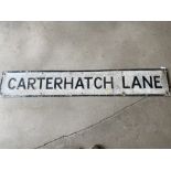 A street name sign for Carterhatch Lane, 56 x 9".