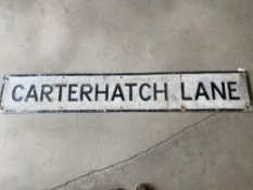 A street name sign for Carterhatch Lane, 56 x 9".