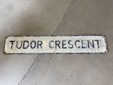 A street name sign for Tudor Crescent, 48 x 9".