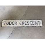 A street name sign for Tudor Crescent, 48 x 9".