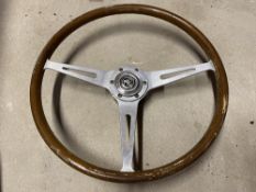 An MG three spoke steering wheel.