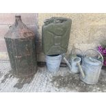 A jerry can, a five gallon conical can, galvanised watering cans etc.