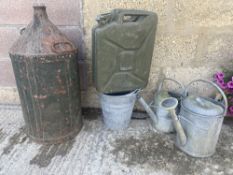 A jerry can, a five gallon conical can, galvanised watering cans etc.