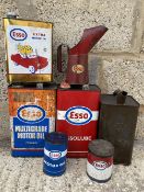A group of Esso oil cans, including a Continental litre can with Mr and Mrs Drip sat in a car,