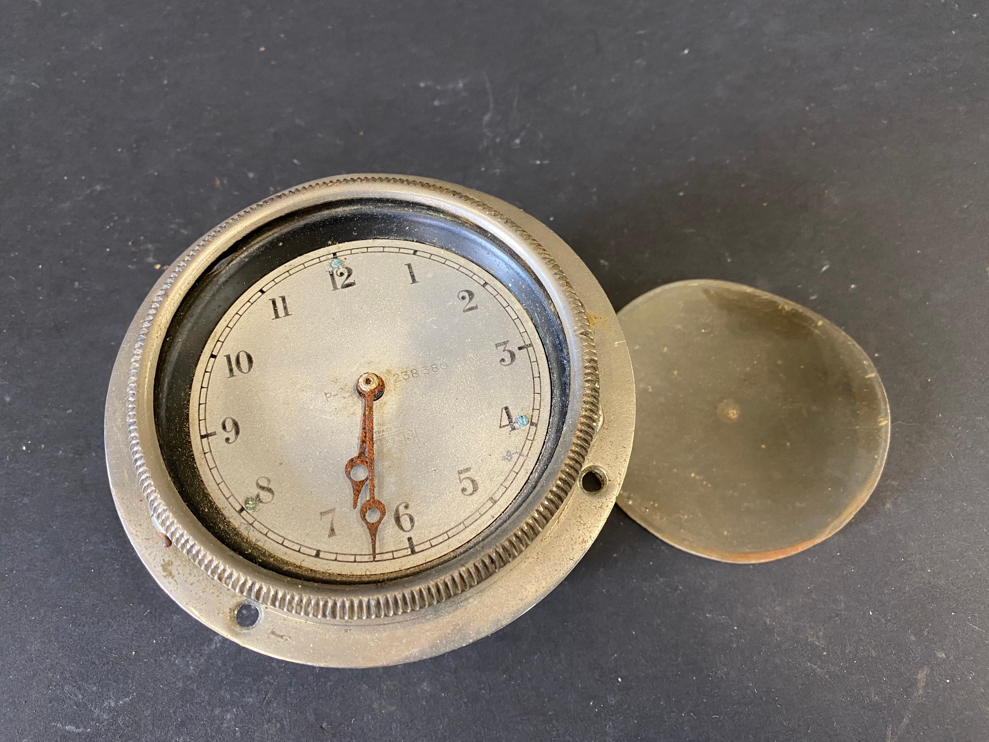 A Smiths silver faced eight day car clock, lacking glass.
