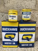 Two Duckhams Motor Oil gallon cans, and two Duckhams grease tins.