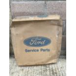 A new old stock Ford Escort radiator in original packaging.