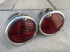 A pair of Lucas King of the Road chrome plated 'pork pie' rear lights with ribbed lenses.