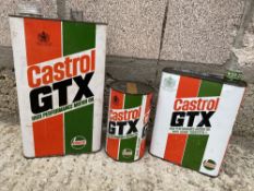 A Castrol GTX gallon can, a Castrol GTX litre can and a matching quart can.