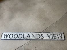 A street name sign for Woodlands View, 49 x 6".