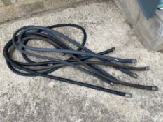 A quantity of petrol pump rubber hoses.