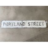 A street name sign for Portland Street, 51 x 9".