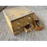 A small pine six drawer chest and a box of dies.