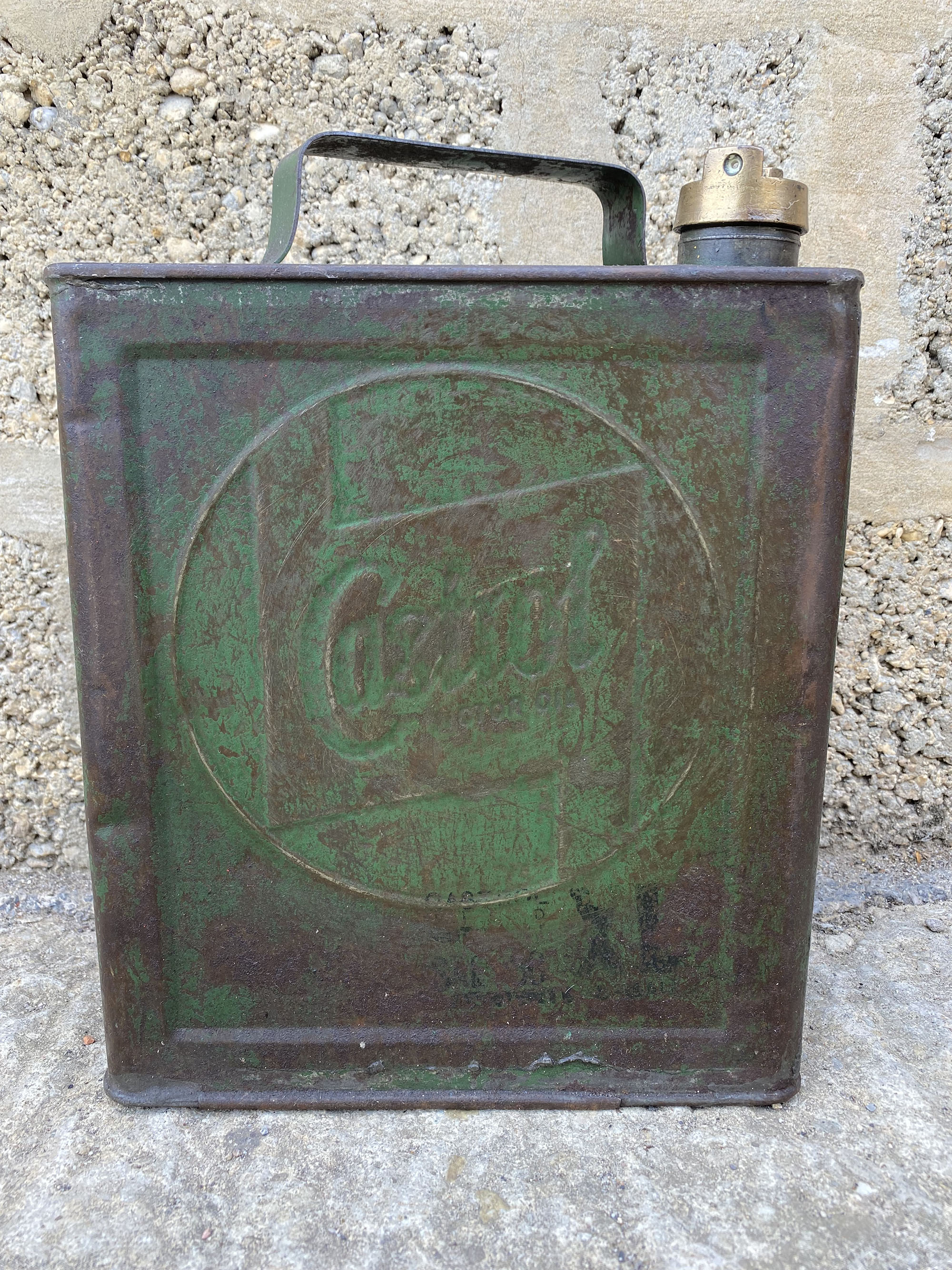 A Castrol Motor Oil two gallon can with a BP brass cap.