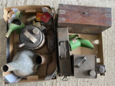 Two boxes of assorted tins and oil measures including a good condition Castrol pint measure.