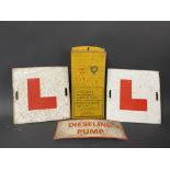 A pair of tin L plates, a Shell BP wall hanging tin rack and a small Dieseline Pump sign.
