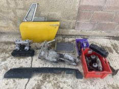 An autojumbler's lot of various parts, many to suit MG Midget, including a nearside door,