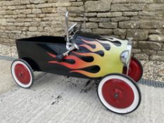 A 'Lightning Hot Rod' pedal car.