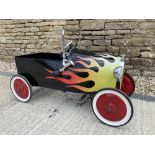 A 'Lightning Hot Rod' pedal car.