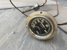 A circa 1920s flange mounted dashboard temperature gauge, with capillary.