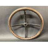 A veteran or Edwardian four spoke dished steering wheel with wooden rim, 17 1/2" w.