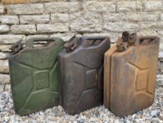 Three jerry cans all stamped WD two dated 1943 and the third 1944.