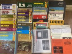 A collection of motorcycle related Haynes manuals, parts lists etc.
