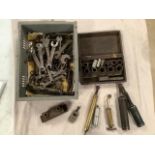 A box of spanners including BSA, Triumph, Humber etc. cable swaging tool and grease guns.