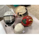 Four used motorcycle helmets including an Everoak Racemaster