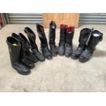 Five pairs of leather motorcycle boots.